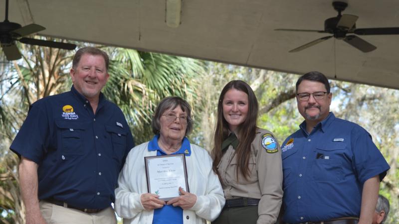 Volunteer receiving award.