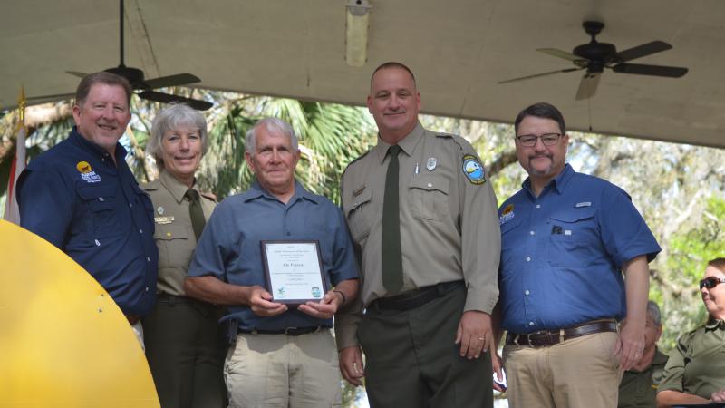 Volunteer receiving award.