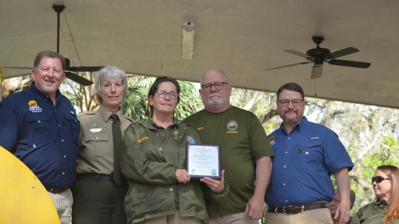Volunteer receiving award.