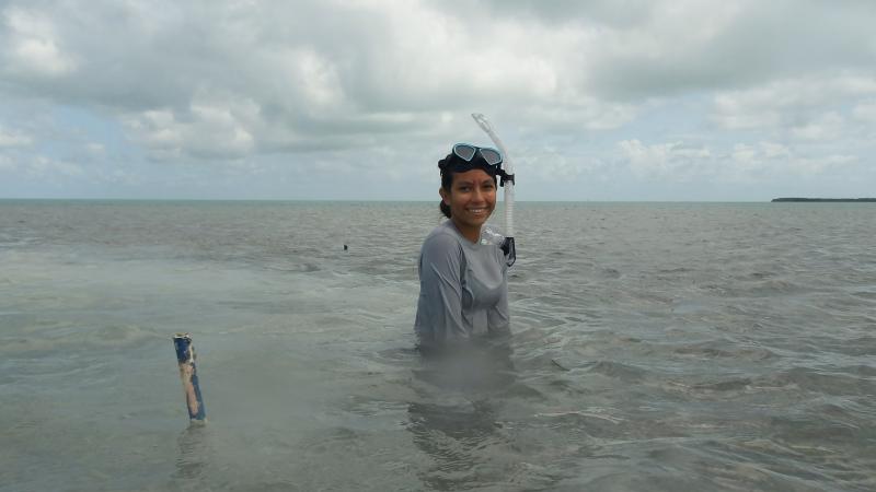 Volunteer Rocio takes a break from seagrass monitoring.