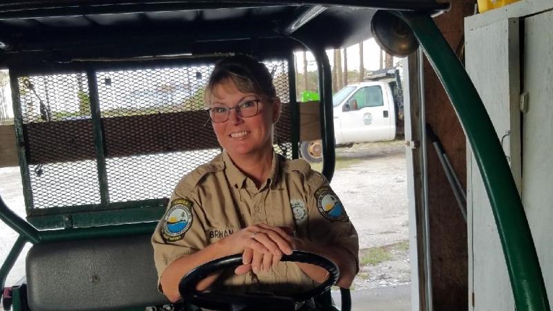 Melody Bamburg sits in the driver seat of an all-terrain vehicle.