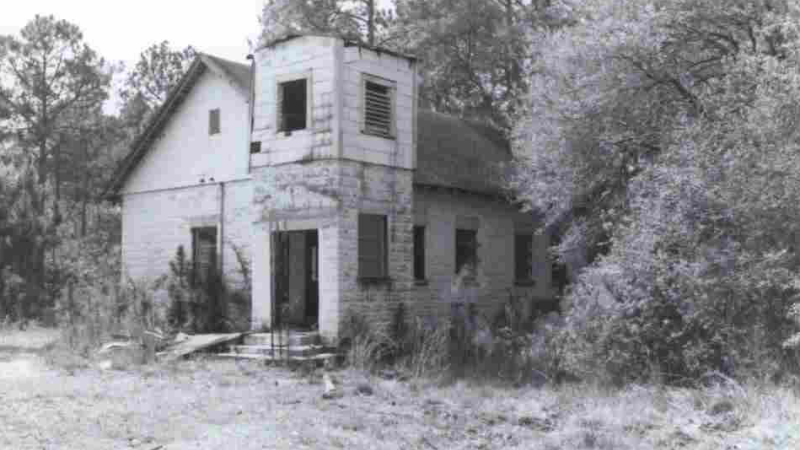 A black and white picture of a church building. 