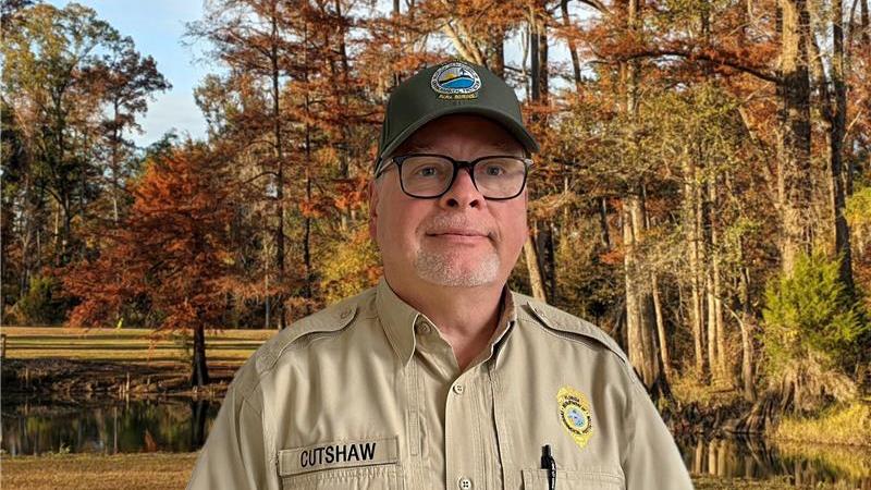 Steve Cutshaw in front of trees.