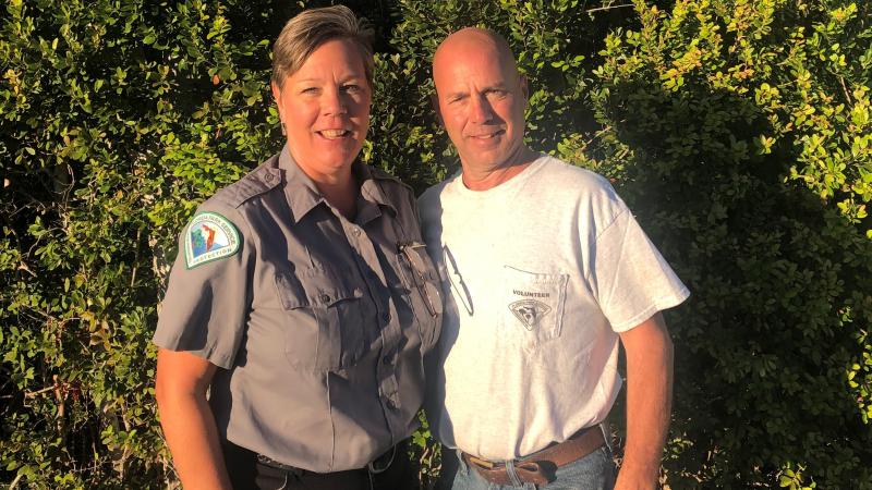 Tom and Michele Bill stand at Long Key State Park in front of native vegetation