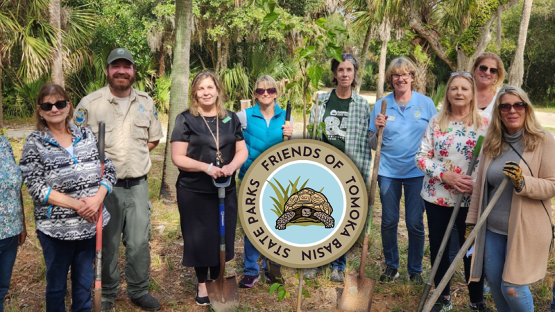 A group of volunteers with the logo of Friends of Tomoka Basin State Parks logo superimposed. 