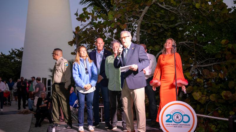 The members standing at dusk.