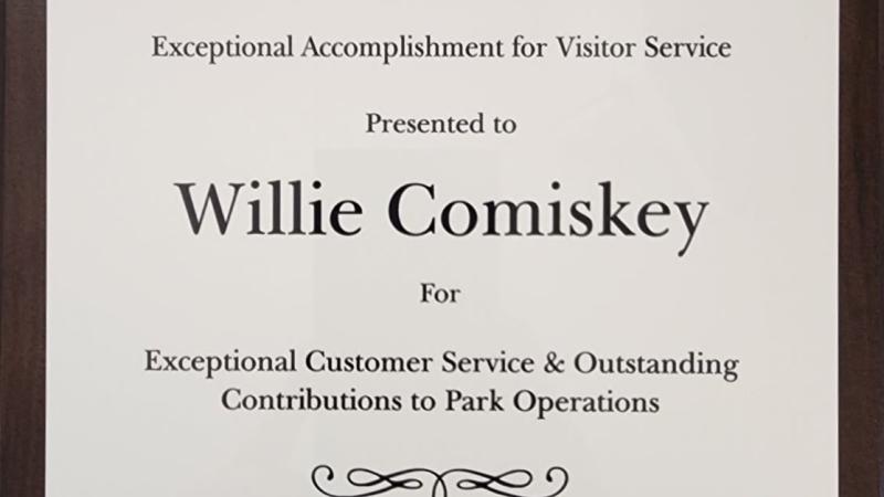 A picture of a plaque honoring Willie Comiskey