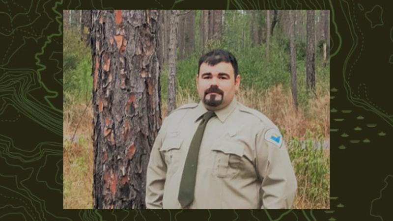 Daryl poses with longleaf pines and wiregrass in the background.