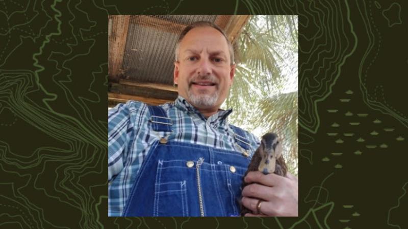 Scott Spaulding poses with his pet duck.