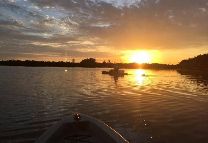 A view of the sunset from a canoe.