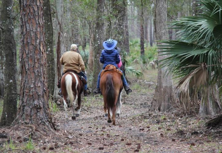 2 horse back riders at Colt Creek