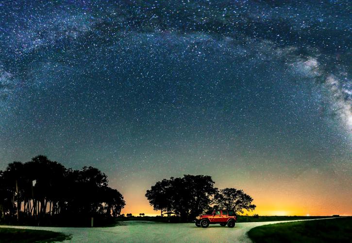 Jeep under night sky