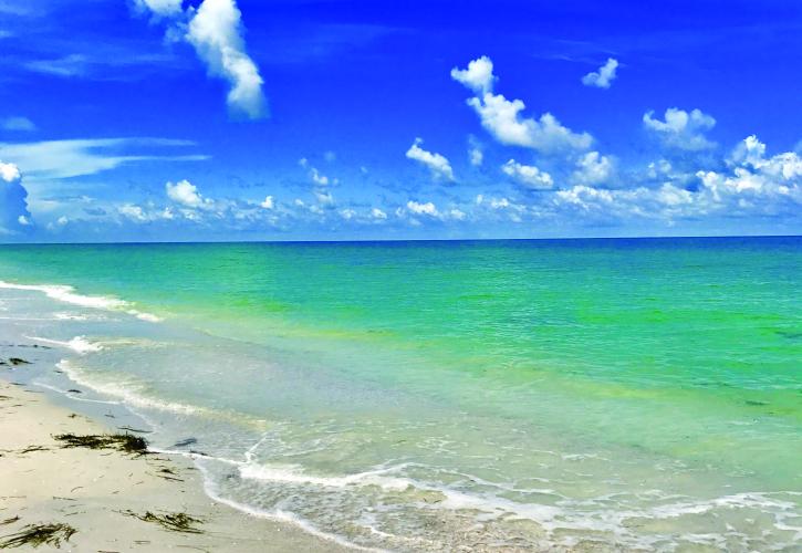 Beautiful emerald colored water on beach