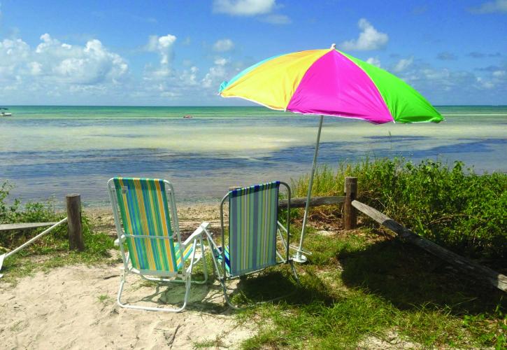 Beach chairs overlooking water