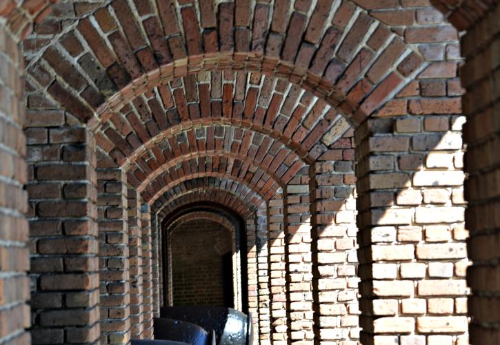 A view of the long brick hallway within the fort.
