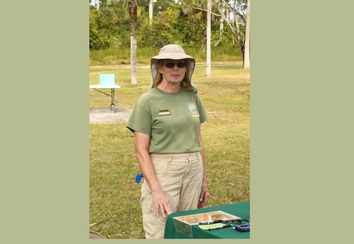 Woman standing near a table outdoors