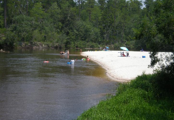 Visitors on Sandy River Bank