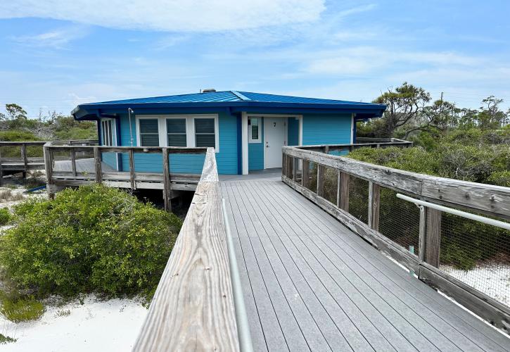 A boardwalk leads to Cabin 7.