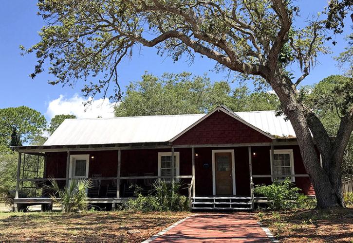 Exterior view of the St Clair Whitman house with oak overhead