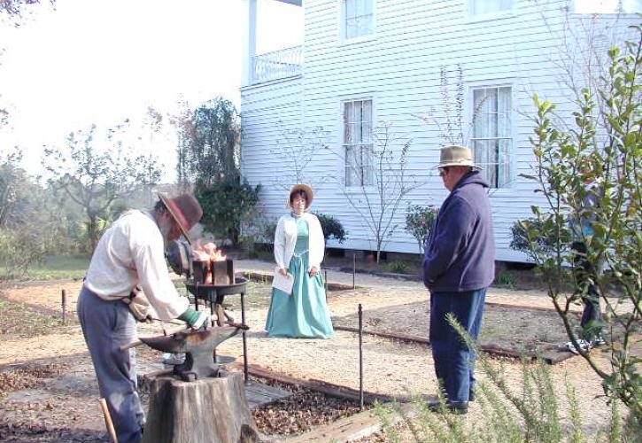 A view of reenactors outside of the orman house.