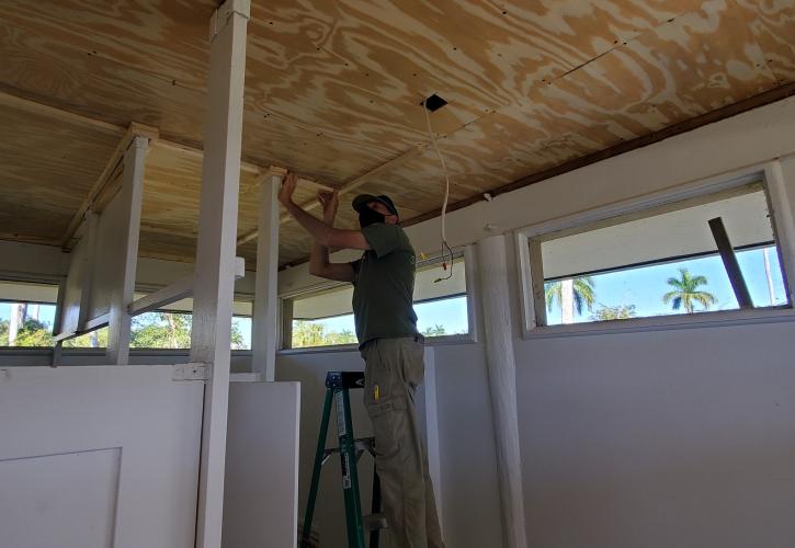 Man working on ceiling repair