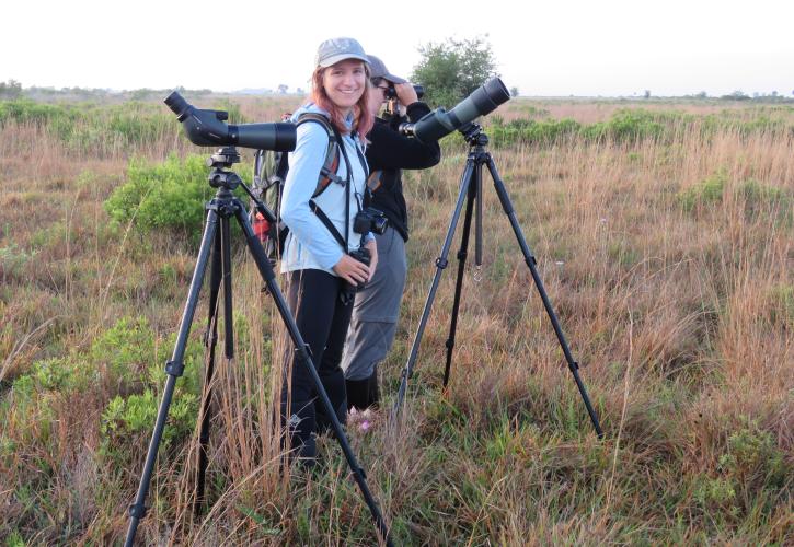 FGSP Technicians Jenna Atma and Bianca Sicich conducting a survey with scopes and binoculars