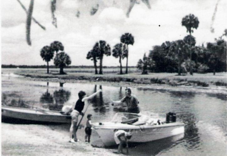 A family enjoys the boat basin dug by the CCC