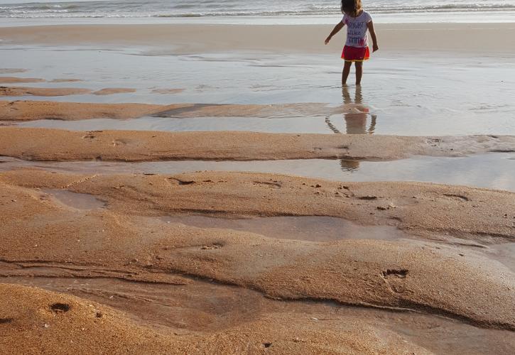 Young child enjoying the beach