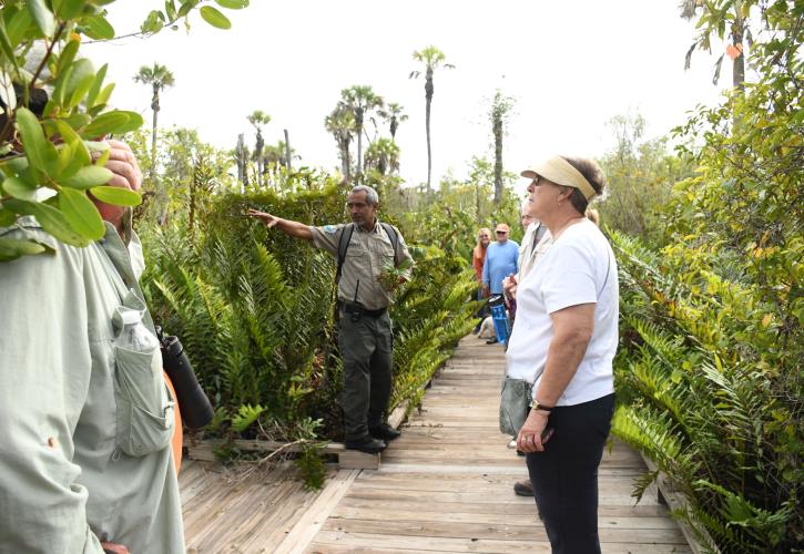 Park Ranger leading a group of people on the nature trail