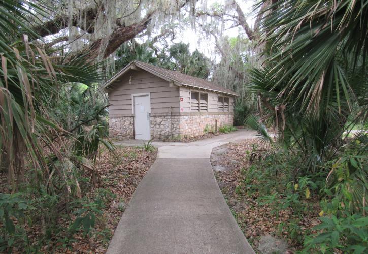 A short walkway leads visitors to the bathroom