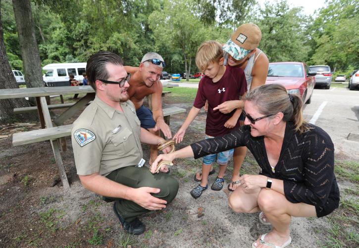 Ichetucknee Springs Ranger showing visitors a local snake