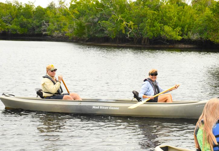 Man and woman in a canoe on the water.