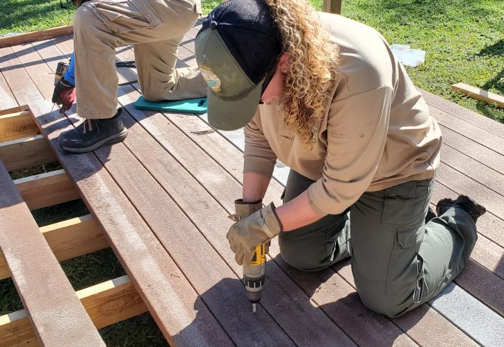 Park Ranger Lauren Sheppard assisting with the construction of an ADA deck and ramp.