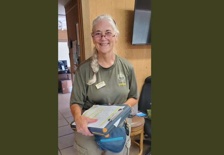 woman holding a binder