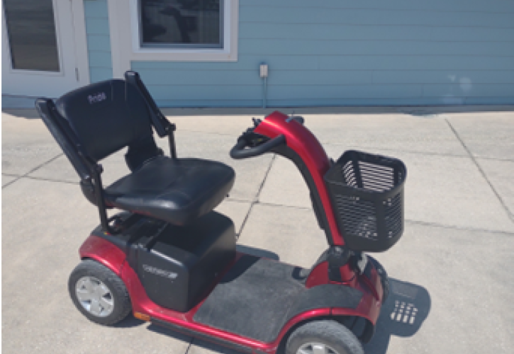 A boardwalk scooter on pavement.