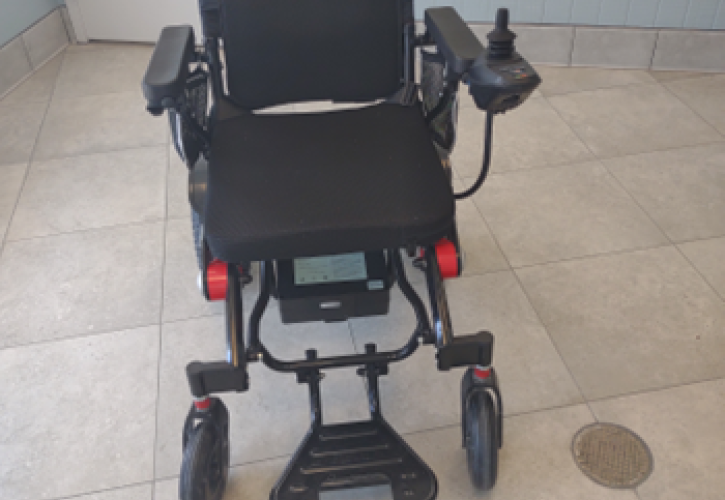 A motorized wheelchair inside.