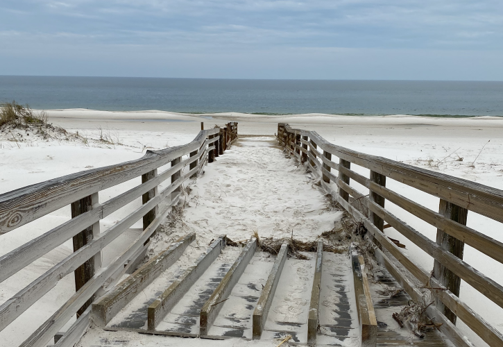 The boardwalk near the fire station sustained damage and was covered by sand.  