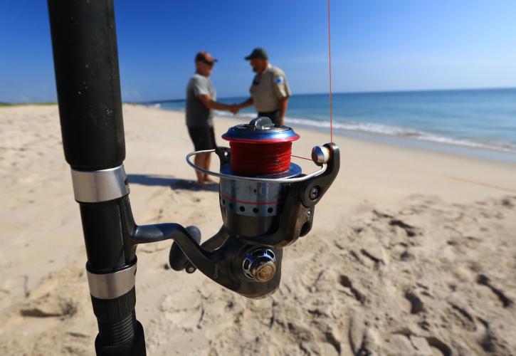 Ranger interacting with fisherman 