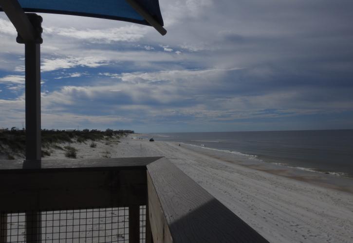 The beach as seen from the top of the boardwalk while facing east.
