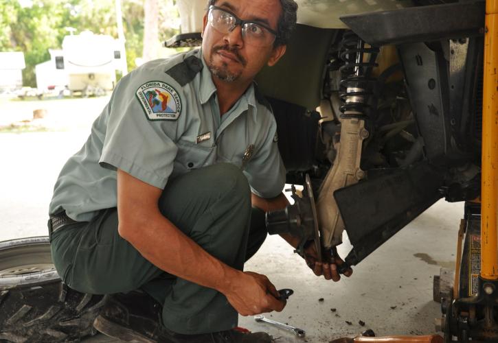 man working on car
