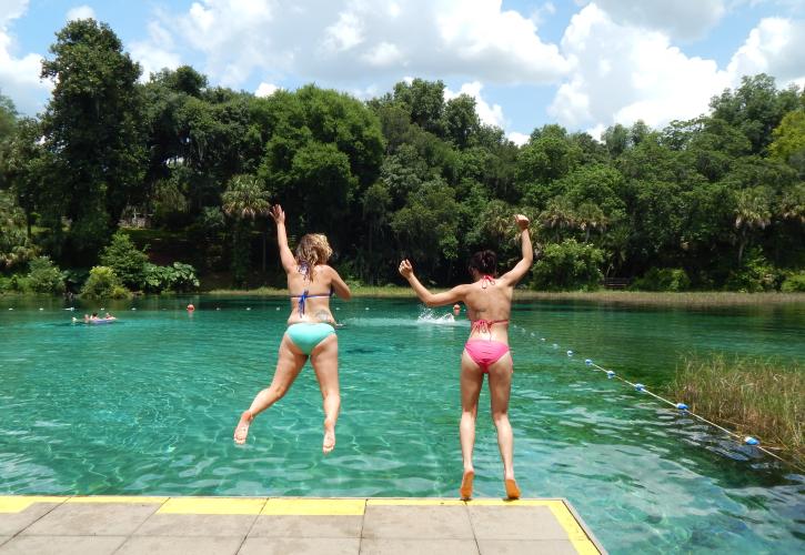 Swimmers Diving off Platform