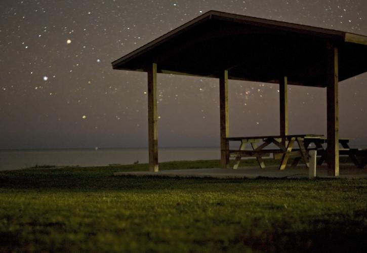 A view of the nights sky from a pavillion