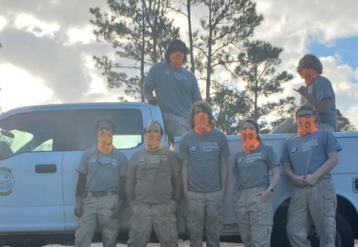 FLCC members deployed to assist with hurricane recovery pose for a photo.