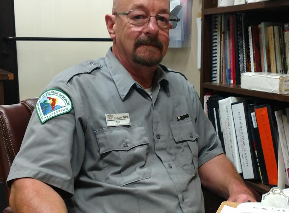 Volunteer William Baker smiling at the camera