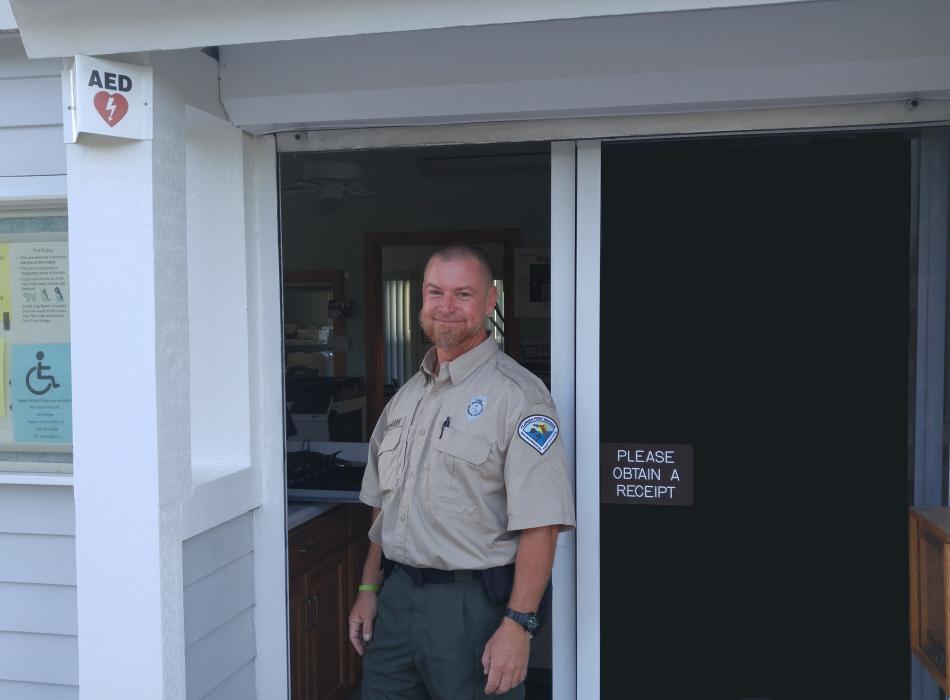 Bryan, standing in the doorway of the ranger station.