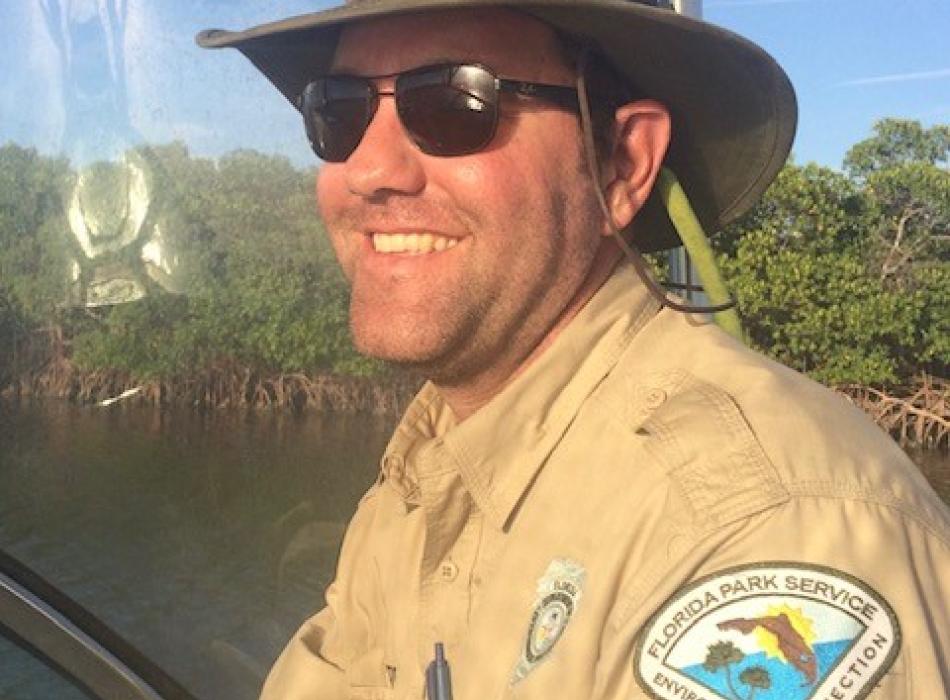 Jason Dorrier smiling at the camera wearing his ranger uniform.