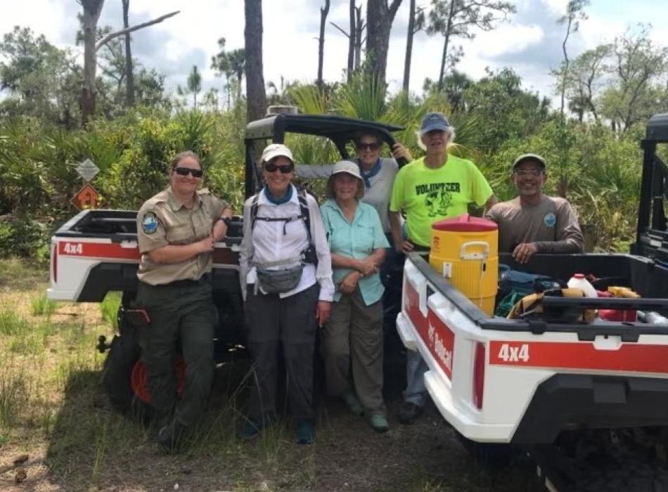 Florida Trails Association members Alligator Amblers with Park Rangers Emily and Henry doing trail maintenance.