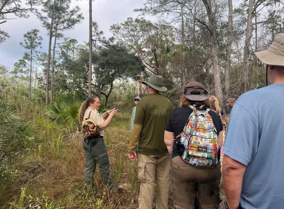 Park Ranger Lauren Sheppard guiding a group for a First Day Hike.