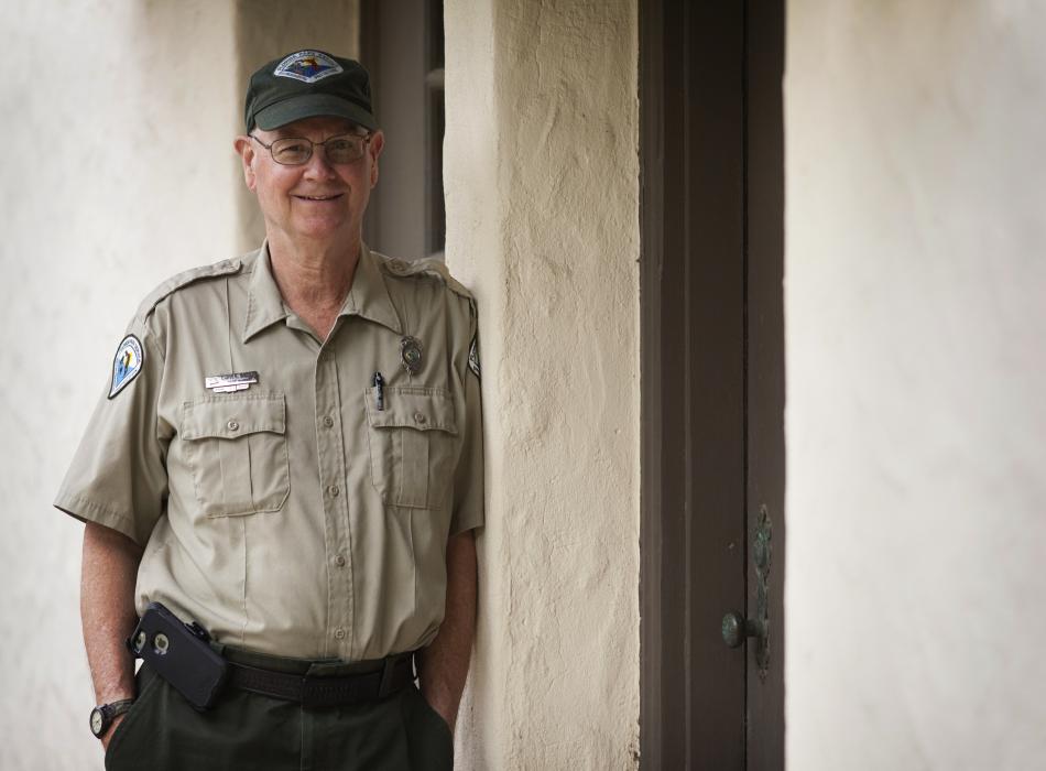 Charlie, dressed in his ranger uniform, smiling at the camera.