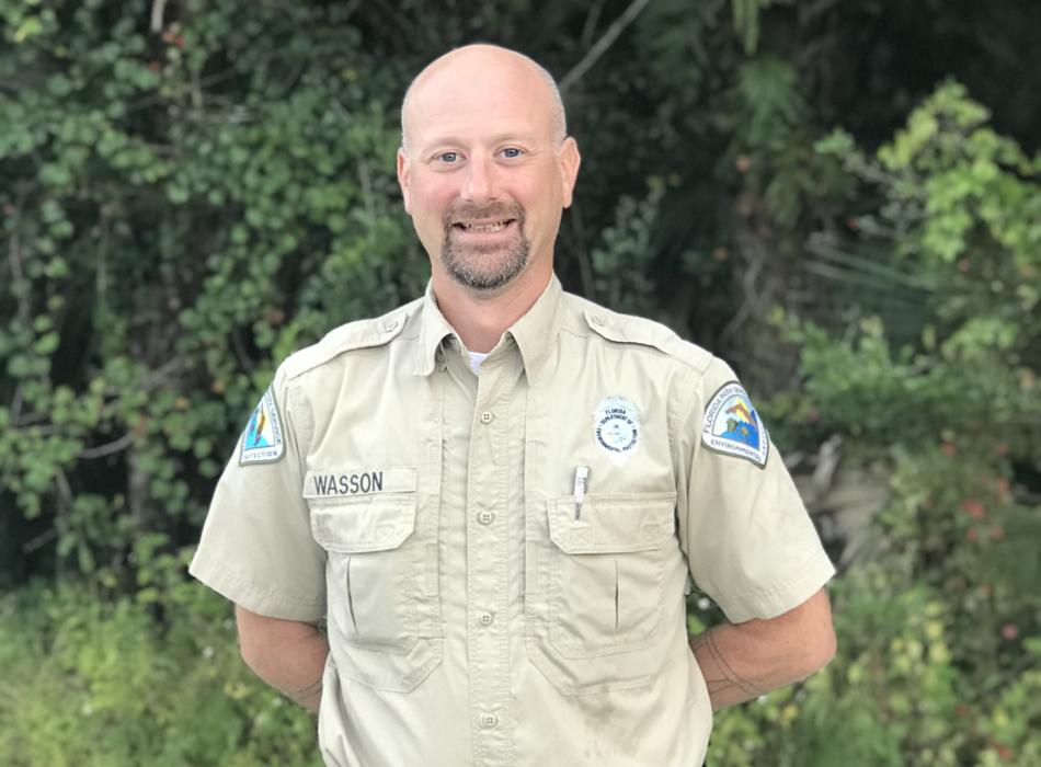 Geoff, wearing his uniform, smiling at the camera.